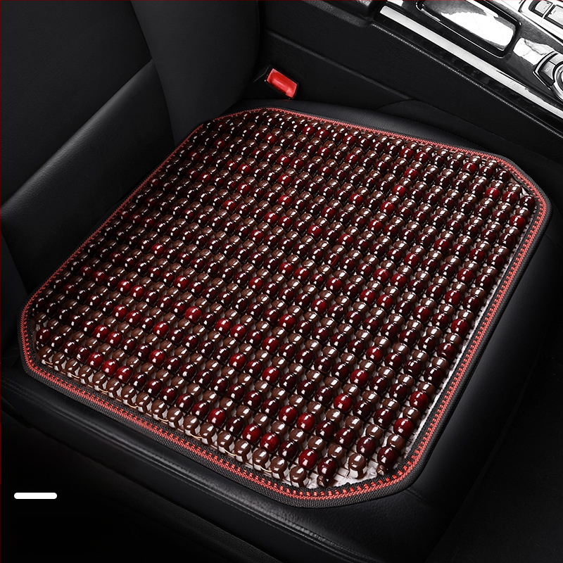 Automobiļa sēdekļa spilvens, viengabala kvadrātiska no koka lodītēm, aizmugures sēdeklim, elpojošs un pretslīdējošs.