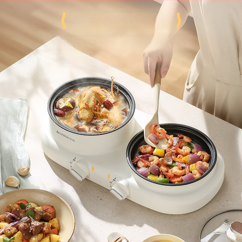 Elektriline mitmekülgne kuum pot üksuses, 600 W, maht 2 L, funktsioonid: aurutamine, praadimine, keetmine, hautamine, kuum pot; plastkorpus; kuivusvastane funktsioon