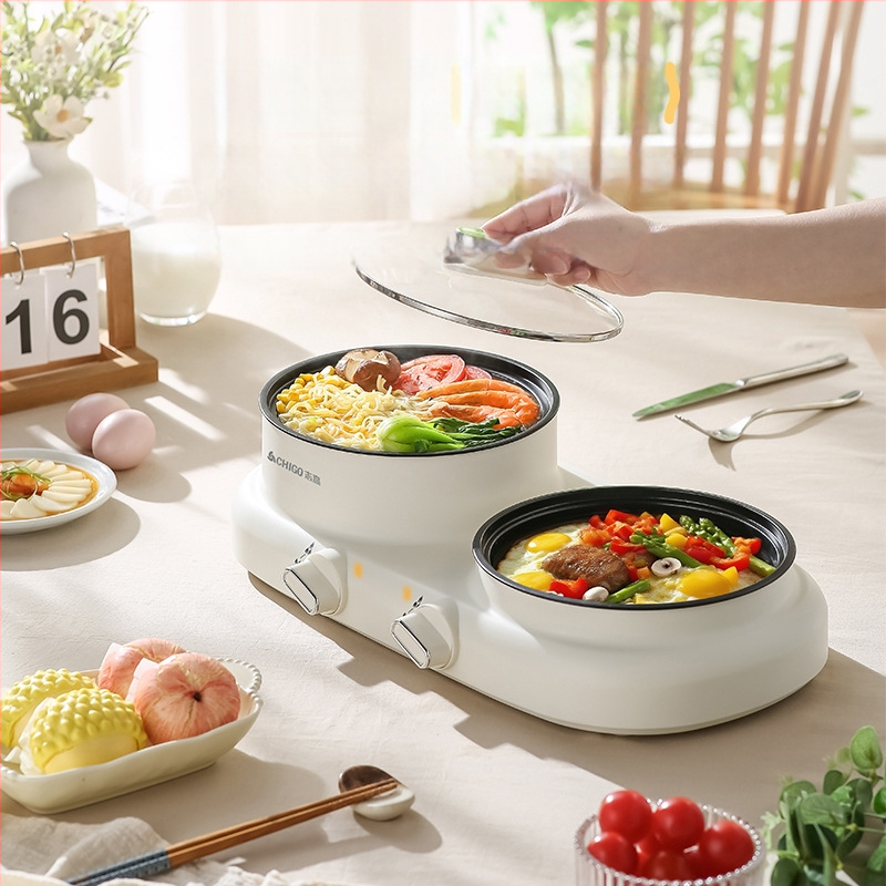 Elektriline mitmekülgne kuum pot üksuses, 600 W, maht 2 L, funktsioonid: aurutamine, praadimine, keetmine, hautamine, kuum pot; plastkorpus; kuivusvastane funktsioon