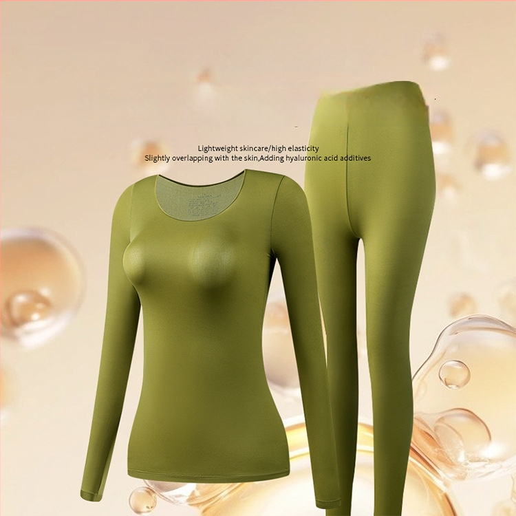 Moterų ultra plonas bešiuvas šilumos termo apatinių komplektas — ilgų rankovių viršūnė ir ilgoms kelnioms; anti‑statinis, kūno formavimas, hidracija hialurono rūgštimi; audinys: nailonas-spandeks (80–90% spandekso).