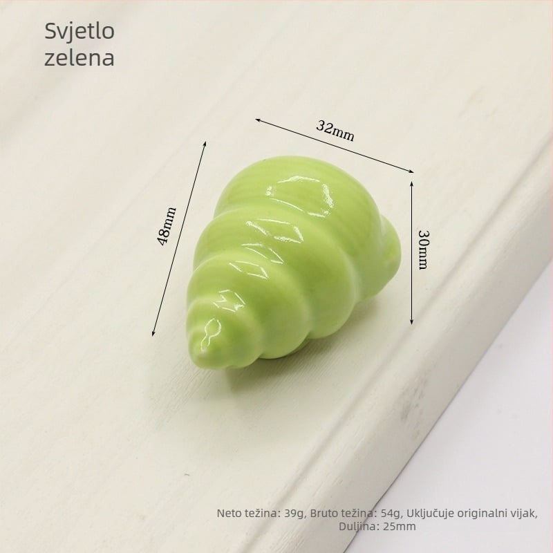 Drška za vrata ormarića u obliku školjke | Materijali: keramika i bakar | Sferni oblik | Ugradnja skrivena | Lijevanje pod pritiskom | Model 1362