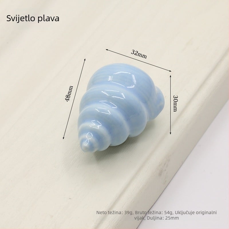 Drška za vrata ormarića u obliku školjke | Materijali: keramika i bakar | Sferni oblik | Ugradnja skrivena | Lijevanje pod pritiskom | Model 1362