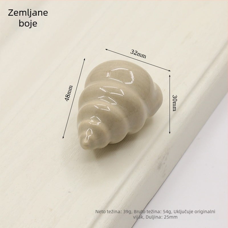 Drška za vrata ormarića u obliku školjke | Materijali: keramika i bakar | Sferni oblik | Ugradnja skrivena | Lijevanje pod pritiskom | Model 1362