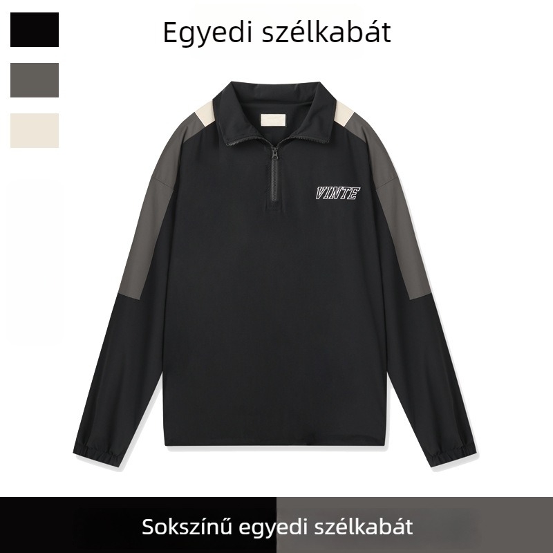 Színblokkoló félzip kabát szélálló és vízlepergető kivitelben, álló gallér, laza szabás