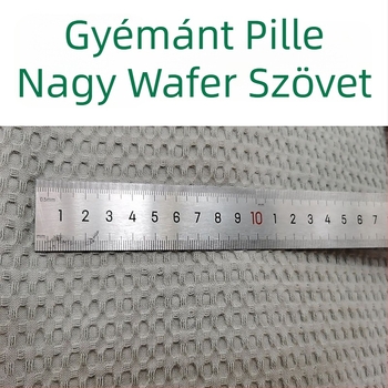 Vaffel pamut anyag — 100% pamut, fonalas színű, geometriai jacquard szövéssel, hálózatos mintázat, alkalmas ágyneműhöz, párnákhoz és takarókhoz, ősz–tél
