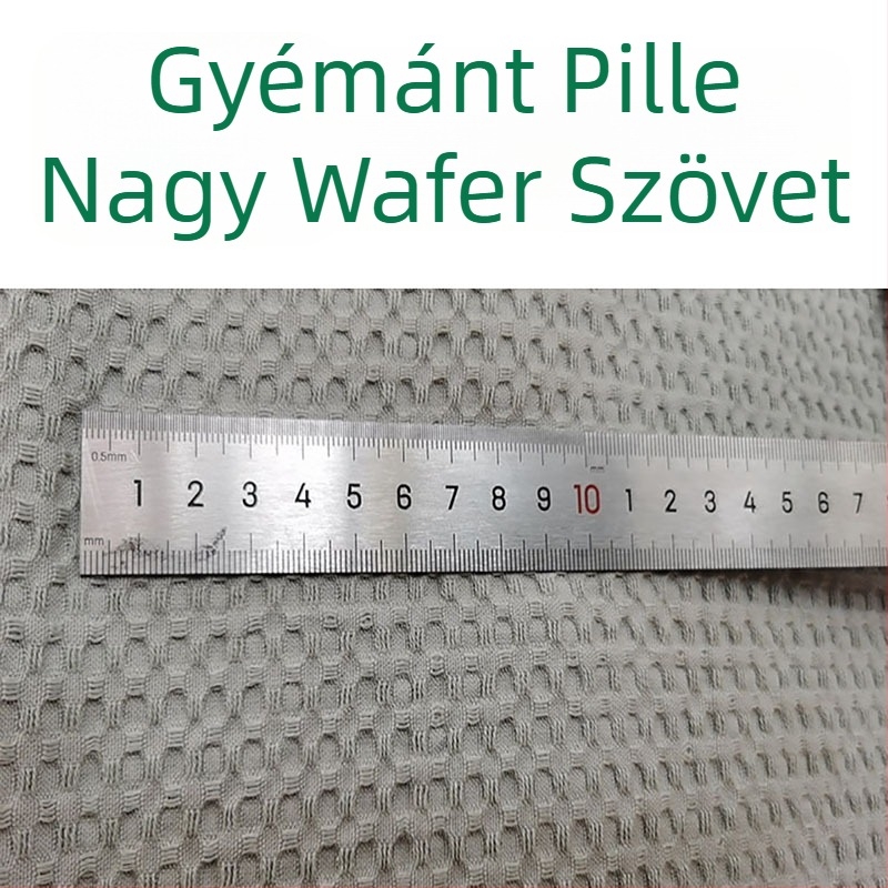 Vaffel pamut anyag — 100% pamut, fonalas színű, geometriai jacquard szövéssel, hálózatos mintázat, alkalmas ágyneműhöz, párnákhoz és takarókhoz, ősz–tél