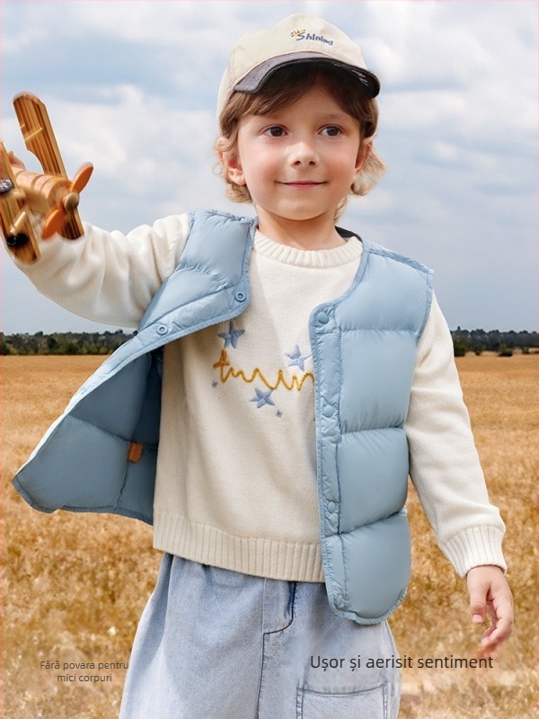 Vestă pentru copii din puf pentru iarnă, fără mâneci; umplutură: 90% puf de rață alb; material exterior și căptușeală din nylon; lungime medie, croială lejeră; pentru copii între 1 și 3 ani.