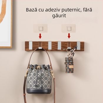 Set de cârlige adezive pentru perete, rând cu patru sau mai multe cârlige, din plastic, încărcare 1–3 kg, design cu textură nuc și aspect pian‑clavă, stil modern minimalist